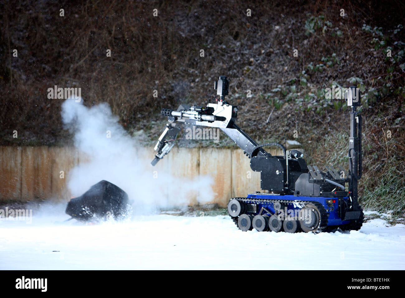 Master-slave manipulators used as an EOD robot to disarm a dangerous explosive like suitcase bombs or other IED by a bomb squad. Stock Photo