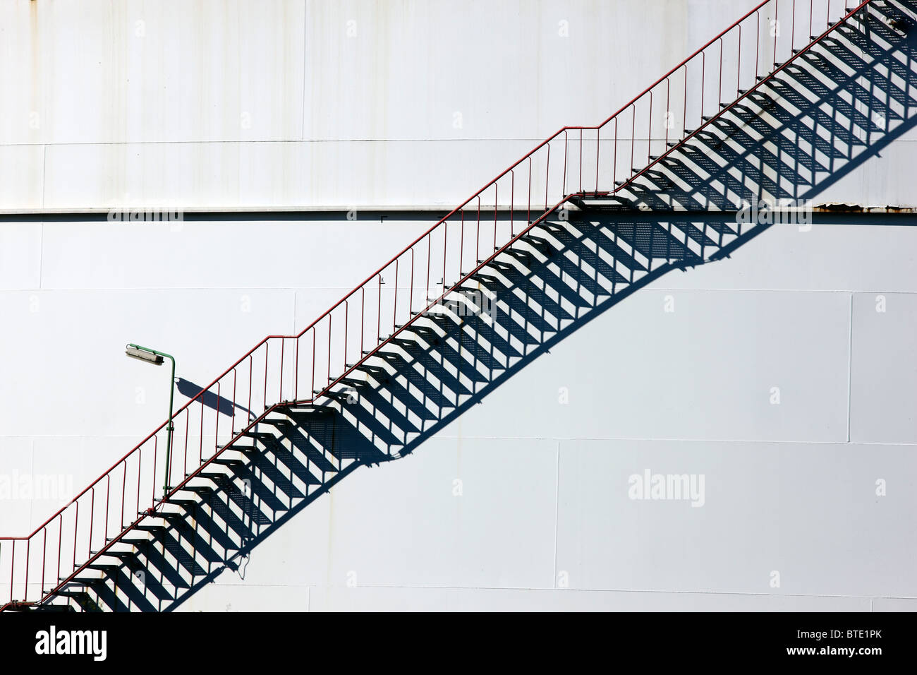 Staircase of a big oil tank in a refinery. Stock Photo
