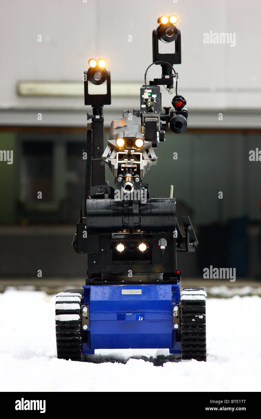 Master-slave manipulators used as an EOD robot to disarm a dangerous ... image.