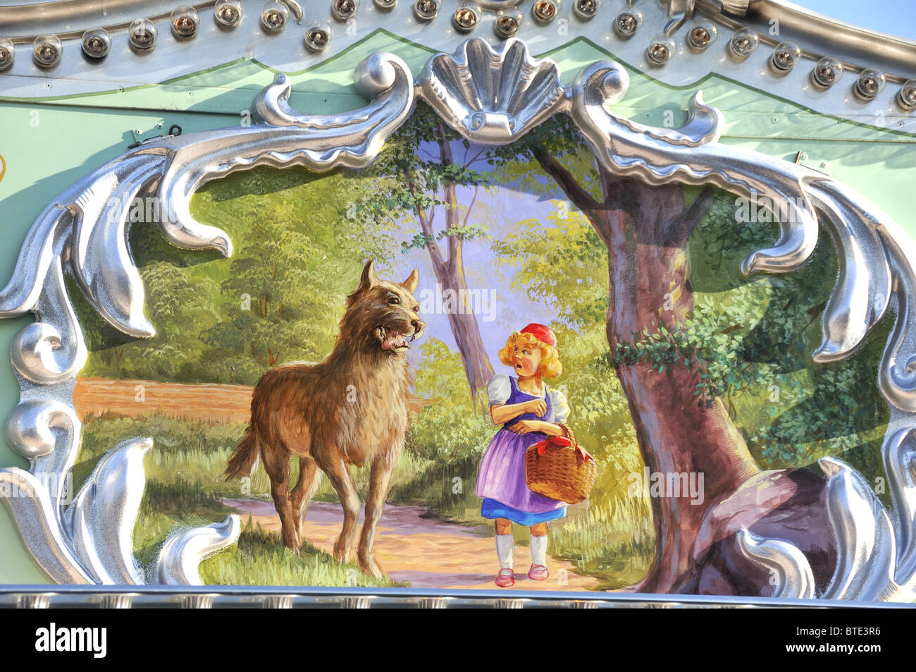 Little red riding hood with wolf fairy story.  Picture taken from painting on fairground ride in Bad Durkheim, Germany Stock Photo