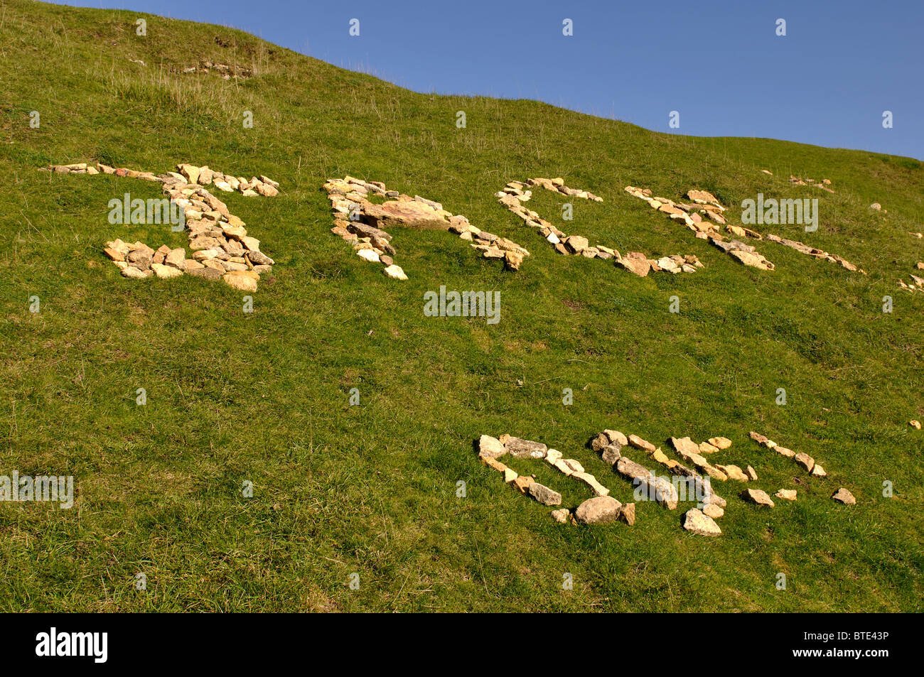 Writing in stone on summit of Bredon Hill, Worcestershire, England, UK Stock Photo