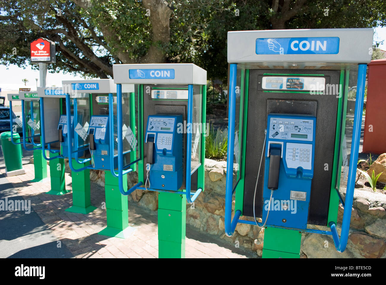 A row of telephone boxes in Gordon's Bay near Cape Town in South Africa. Stock Photo