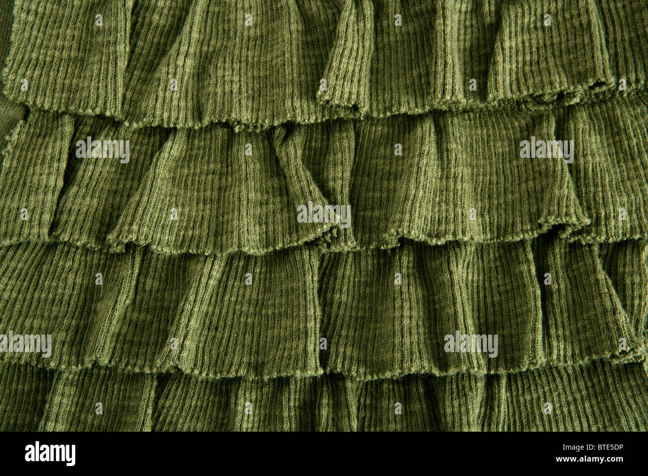 pleated skirt fabric fashion in green closeup macro Stock Photo
