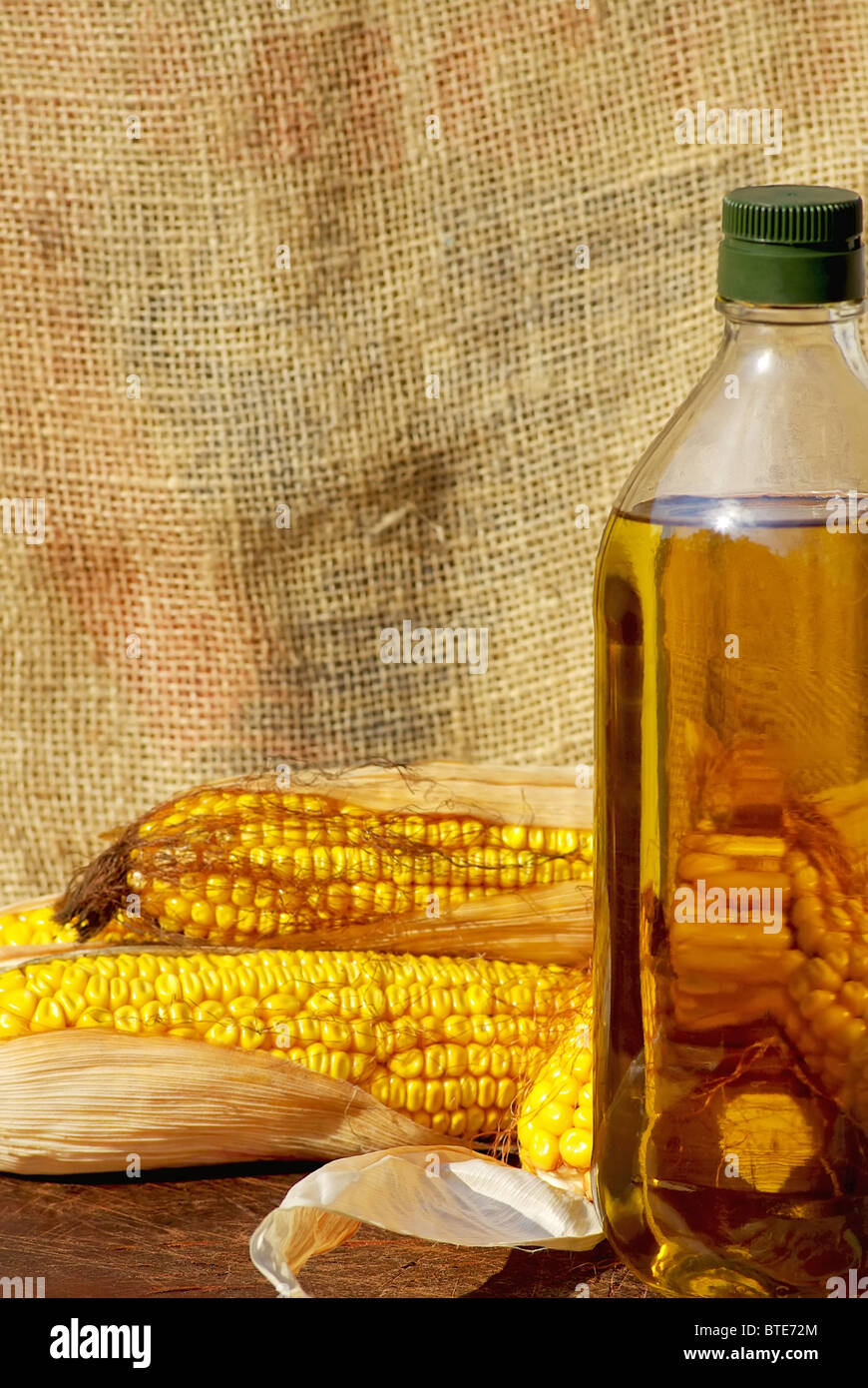 Yellow corn and oil. Stock Photo