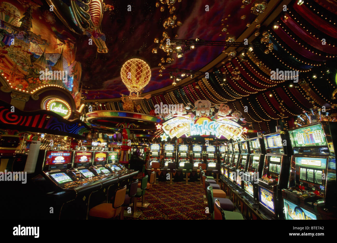 Interior of the Carnival City Casino in Johannesburg showing rows of slot machines and elaborate décor Stock Photo