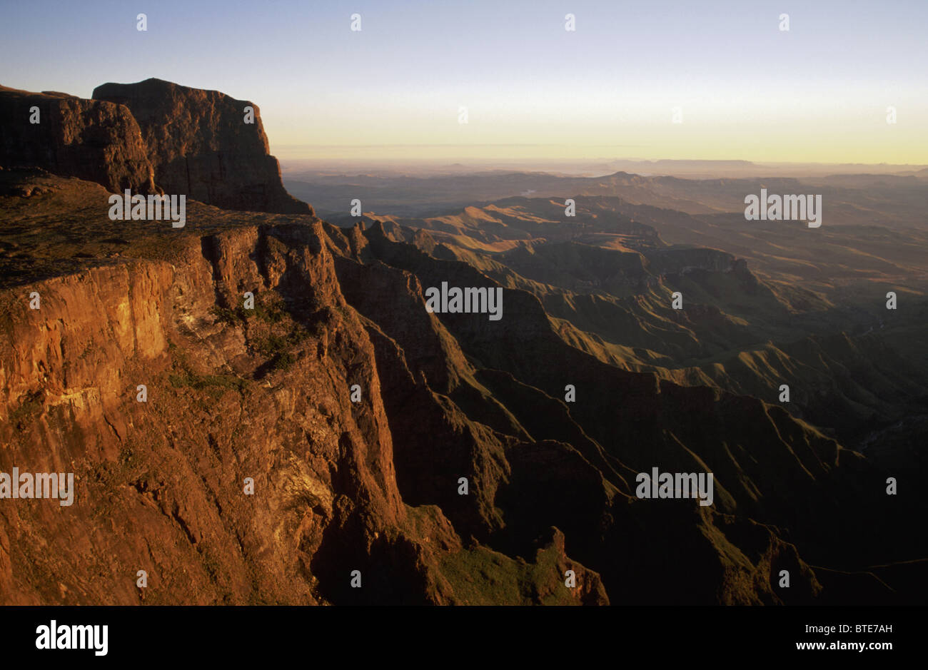 A Golden view of the Amphitheatre at dawn in the Royal Natal National ...