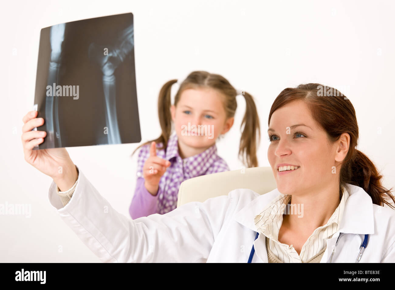 Young female doctor show xray to child at medical office Stock Photo Alamy