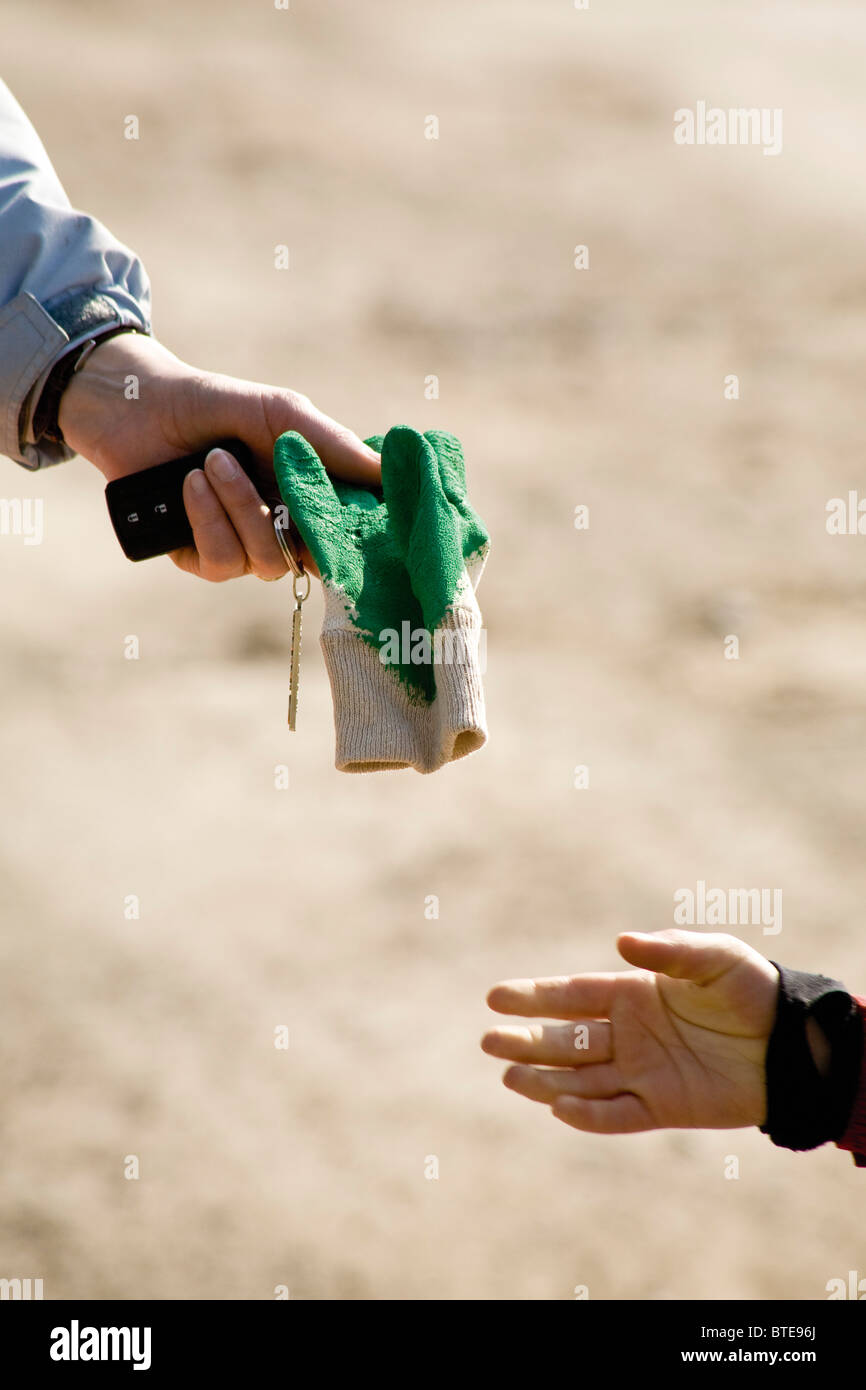 Handing Item Holds Handing High Resolution Stock Photography and Images - Alamy