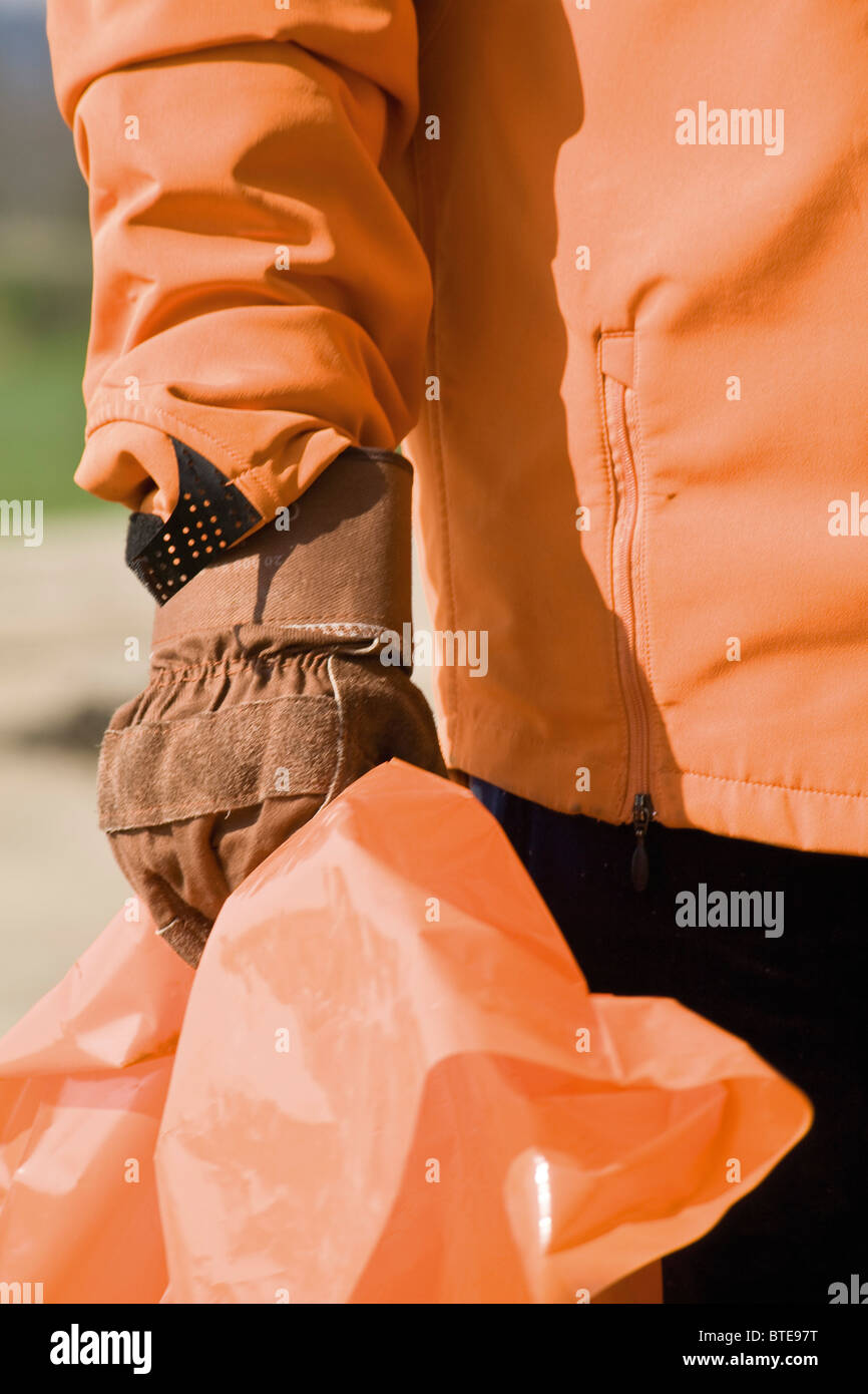 Holding garbage bag, cropped Stock Photo Alamy