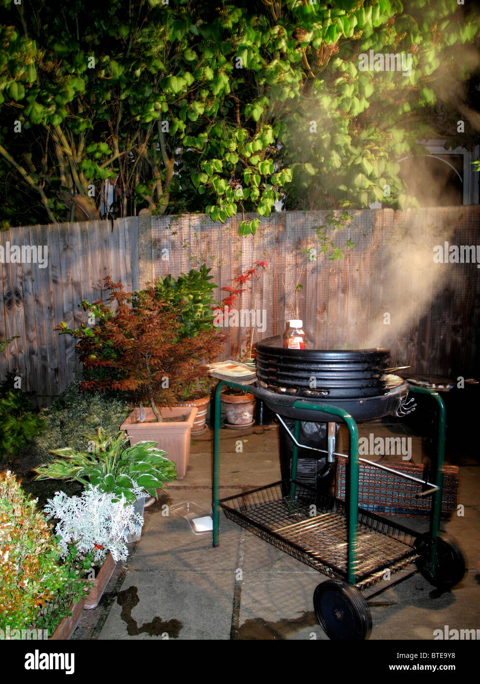 Barbecue grill being used at night Stock Photo