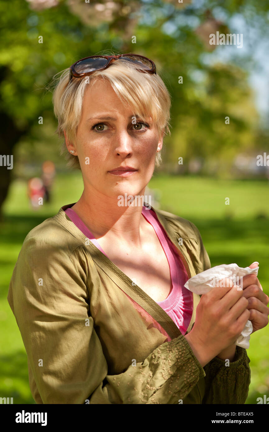 Woman suffering from hay fever Stock Photo