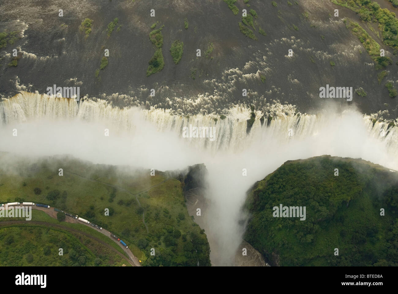 An aerial view of the Victoria falls and the road linking Zimbabwe and Zambia Stock Photo
