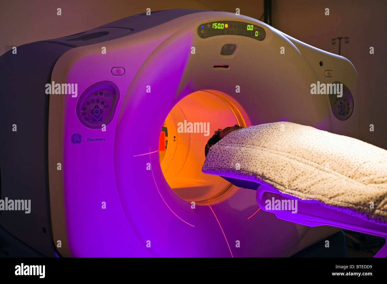 Patient having PET CT diagnostic medical scan, CAT Scan, in hospital Stock Photo