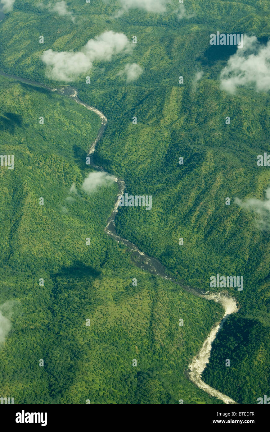 Aerial scenic view of river flowing in a wilderness area with no roads Stock Photo