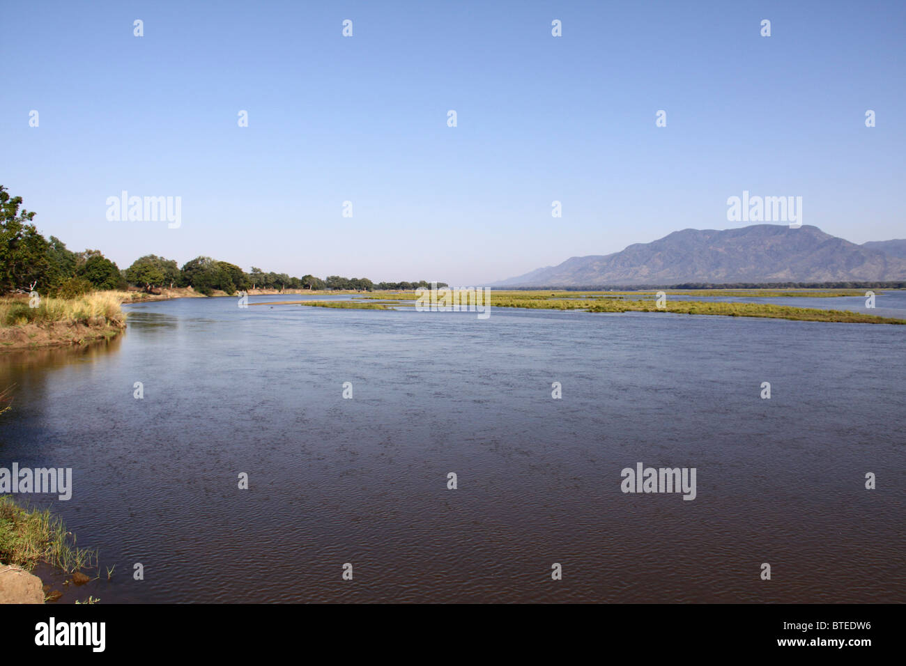 Zambezi river with mountains in the background Stock Photo