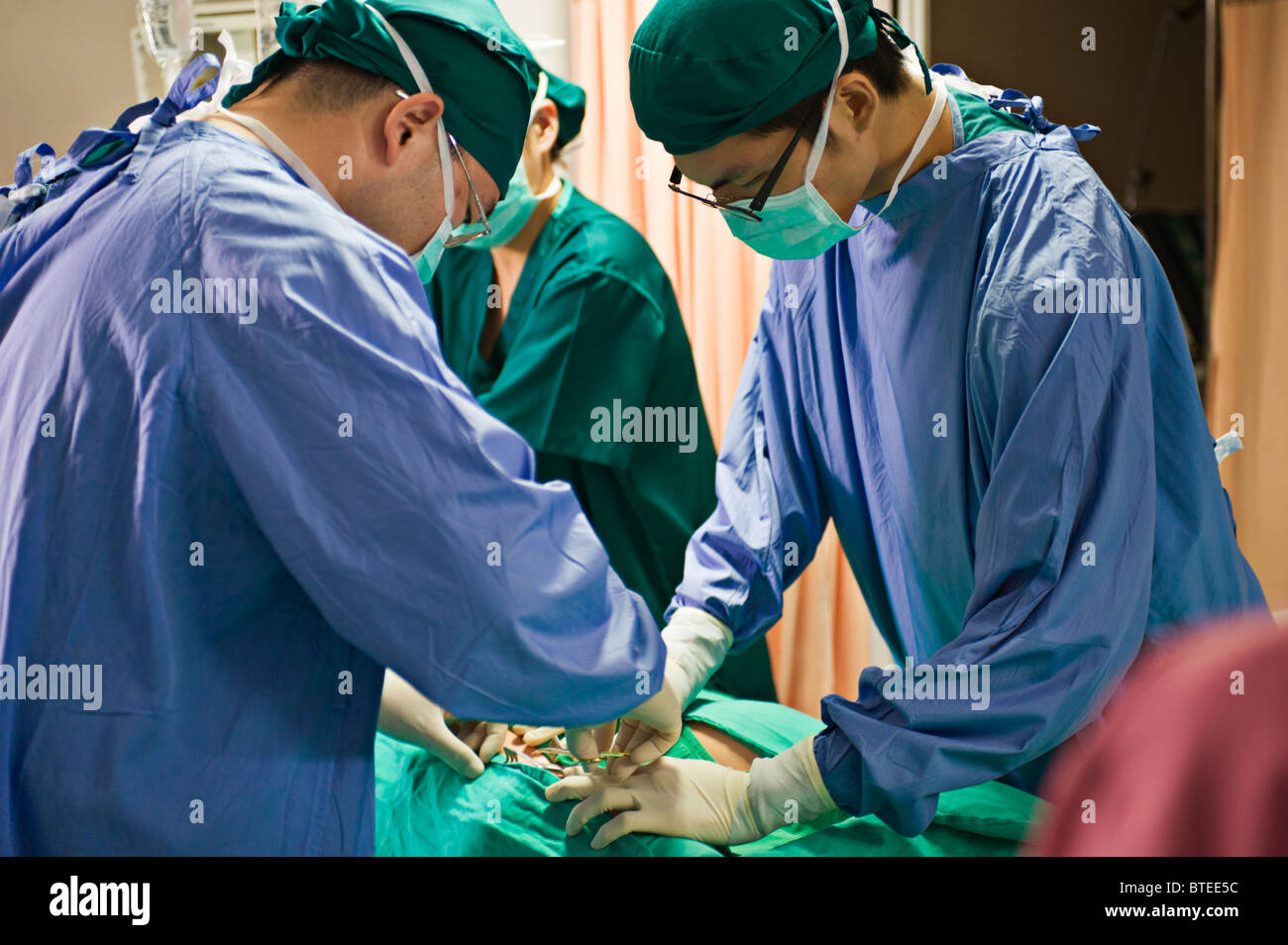 Surgery performed in hospital ICU Stock Photo