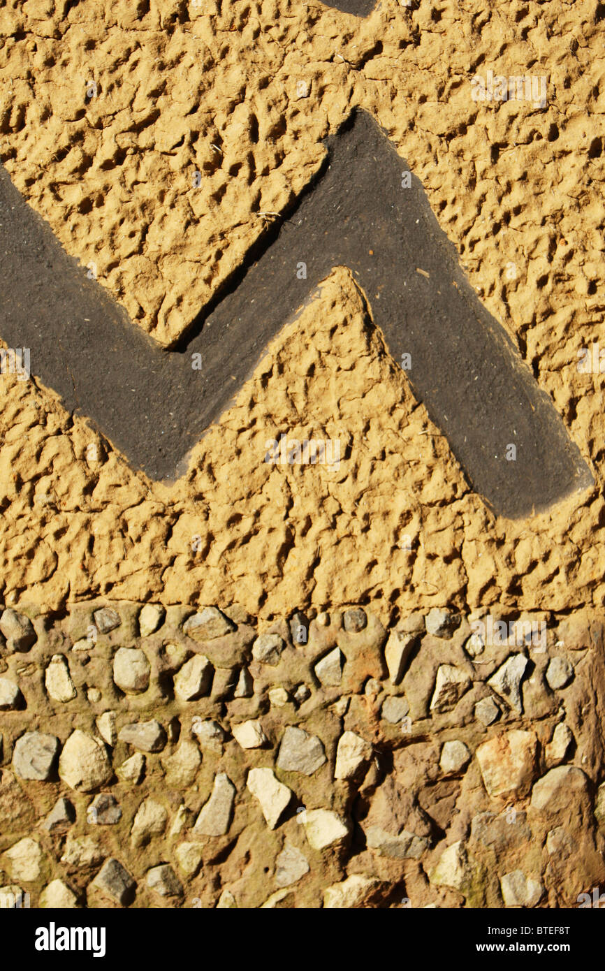 Zigzag pattern on a kraal wall Stock Photo