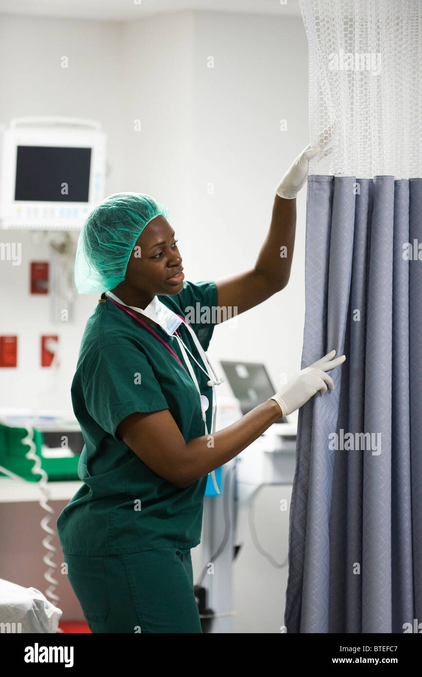 Nurse closing privacy curtain in hospital room Stock Photo Alamy