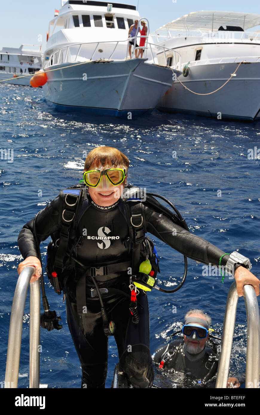 Scuba diver climbing a ladder on a diving boat in the Red Sea Stock Photo Alamy