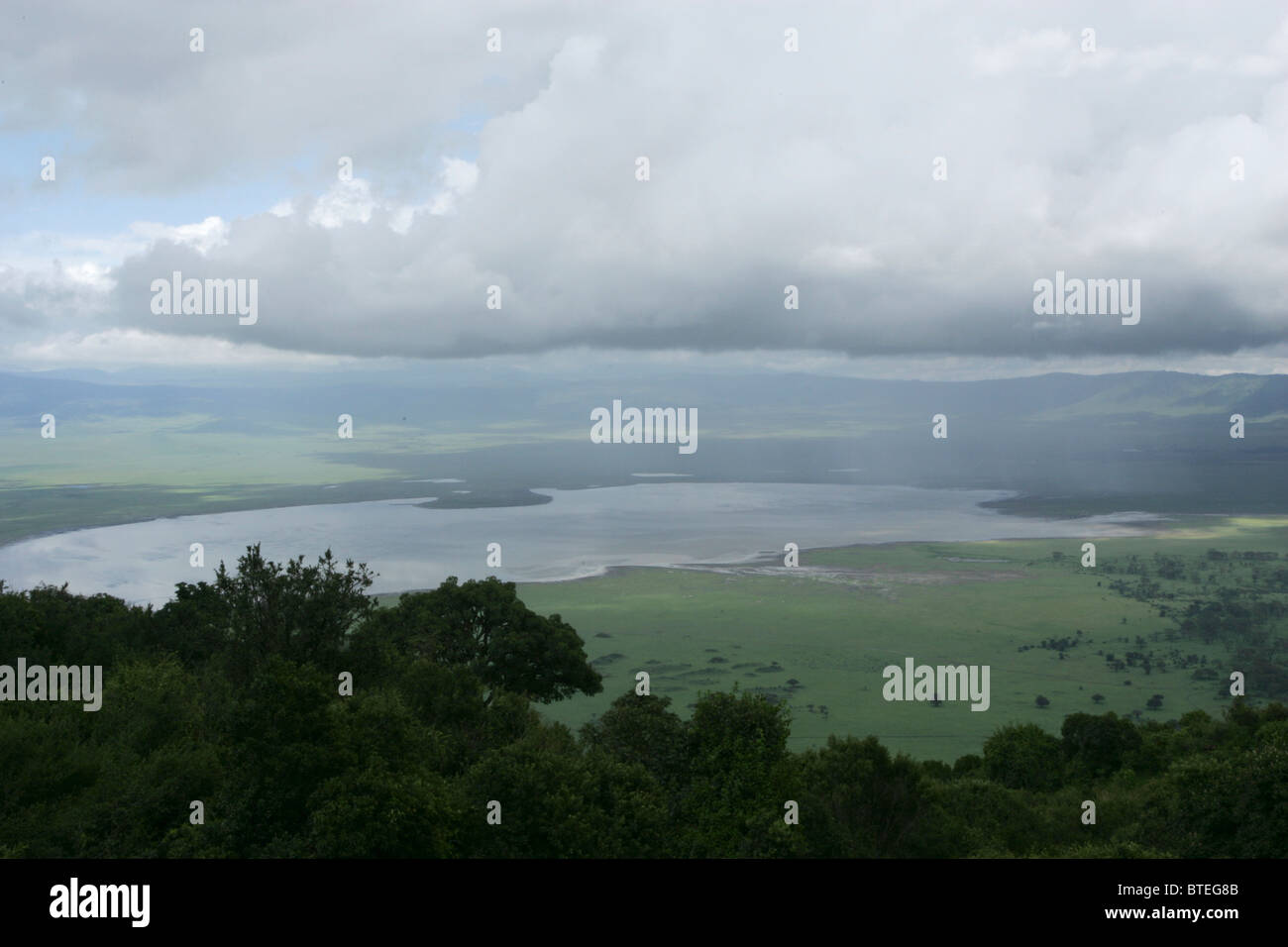 Crater and mist with a view to lake Magadi on the Crater floor Stock Photo