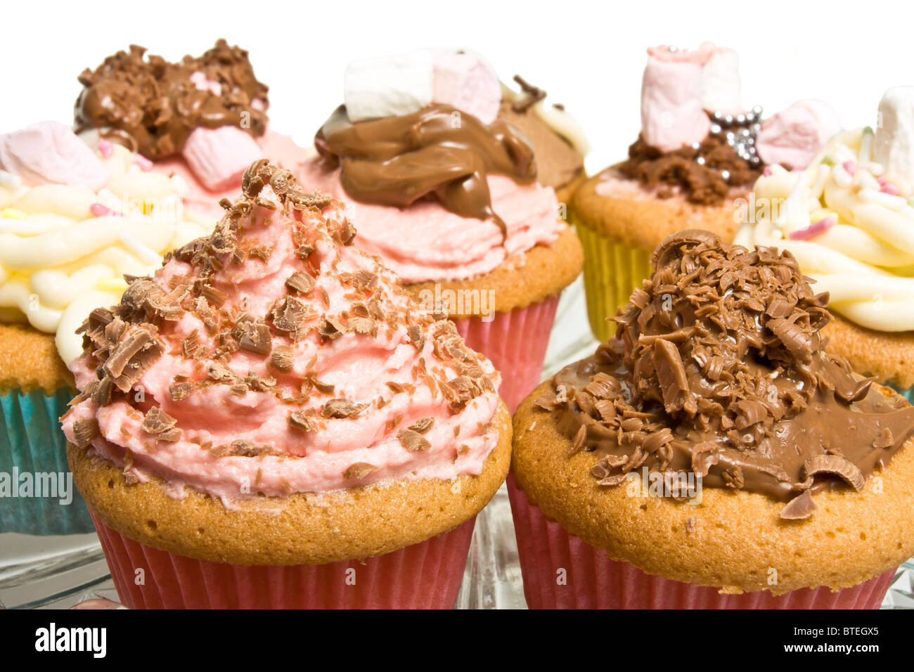 Cupcake background of fancy homemade cupcakes with shallow focus. Stock Photo