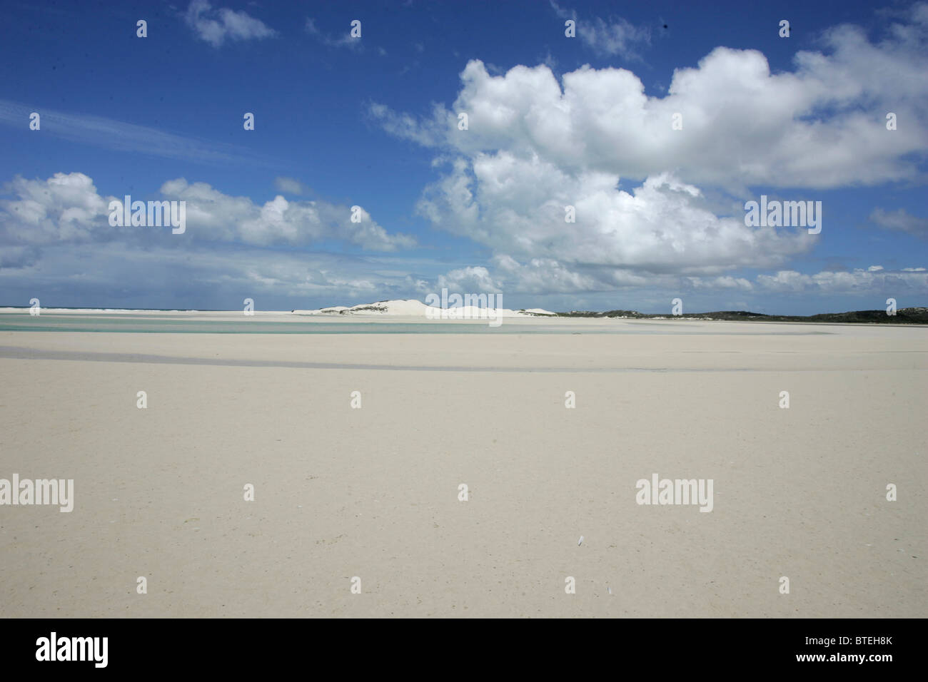 Beachscape with clouds overhead Stock Photo