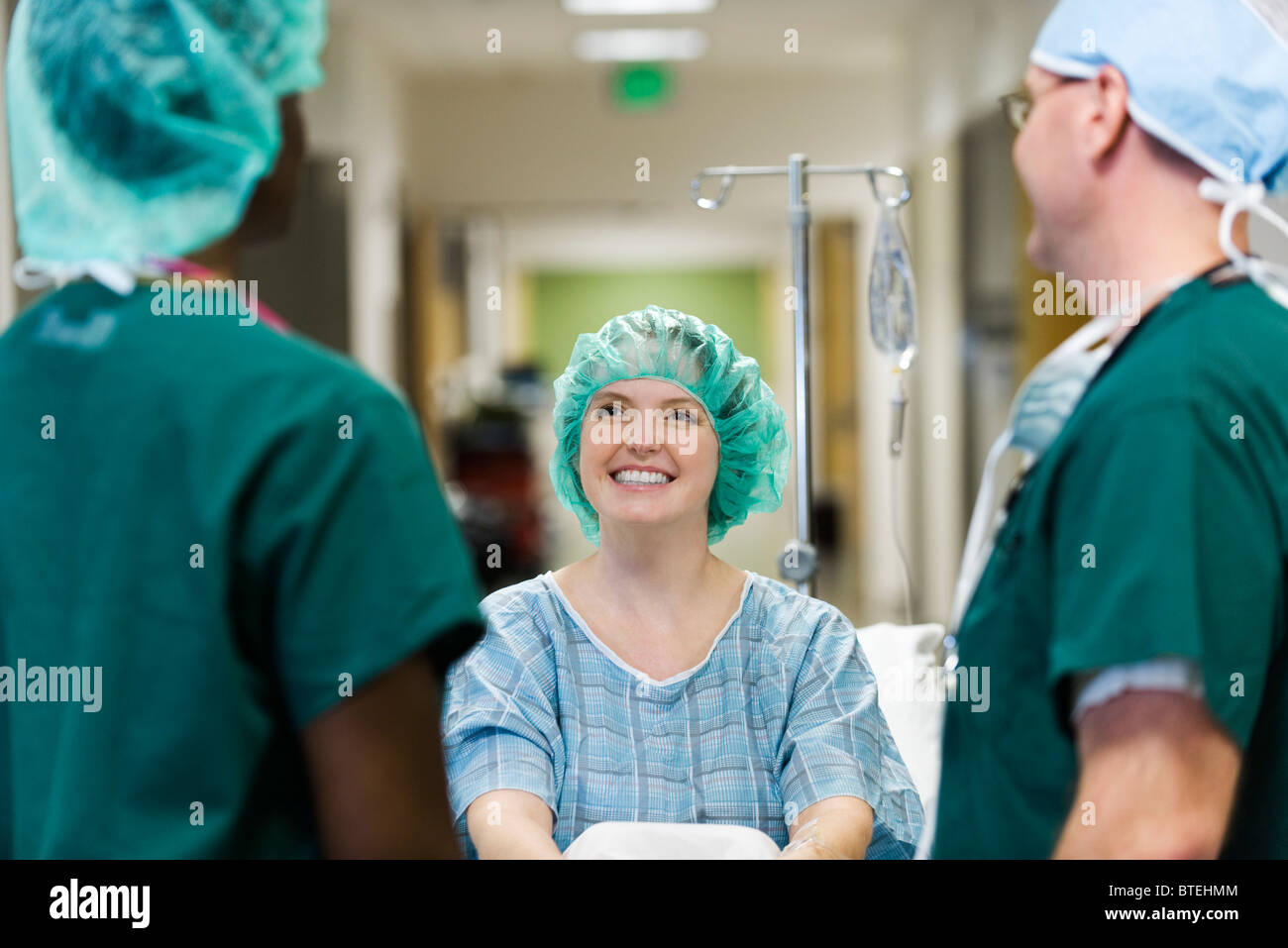 Patient chatting with healthcare workers Stock Photo