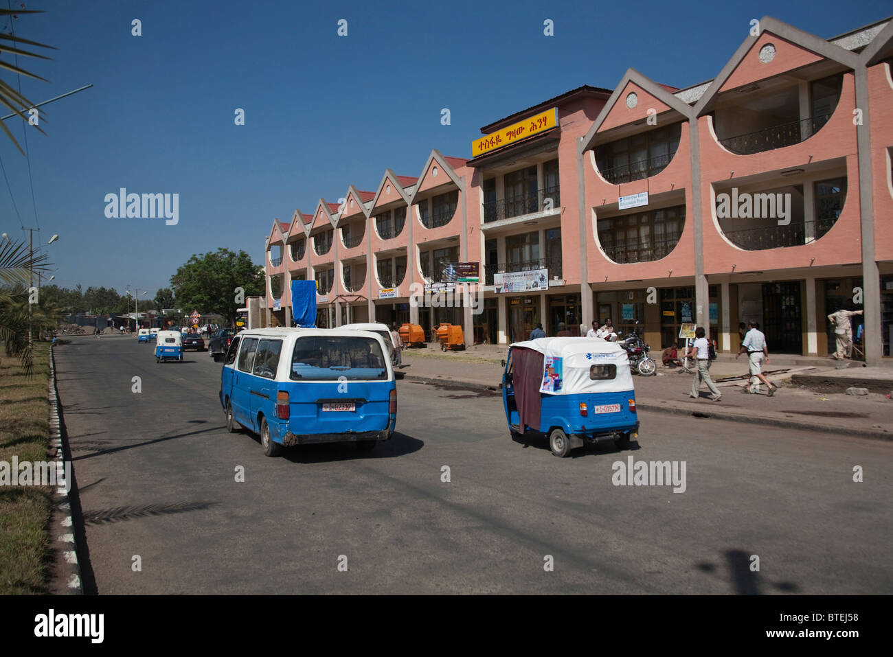 Downtown Awassa with blue taxis and bajaj vehicles Stock Photo