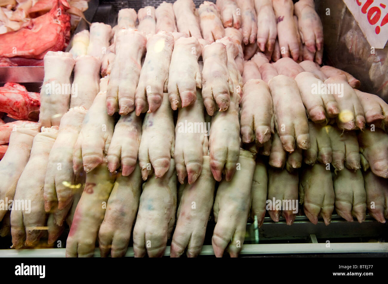 pigs trotters for sale in a meat deli inside Budapest's biggest market