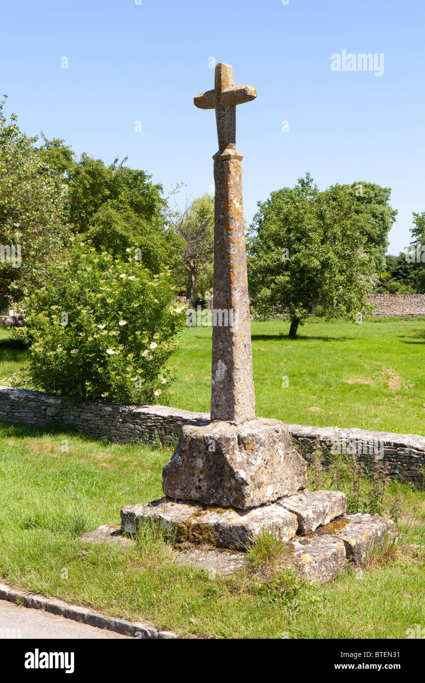 The 14th century wayside cross in the Cotswold village of Condicote, Gloucestershire Stock Photo