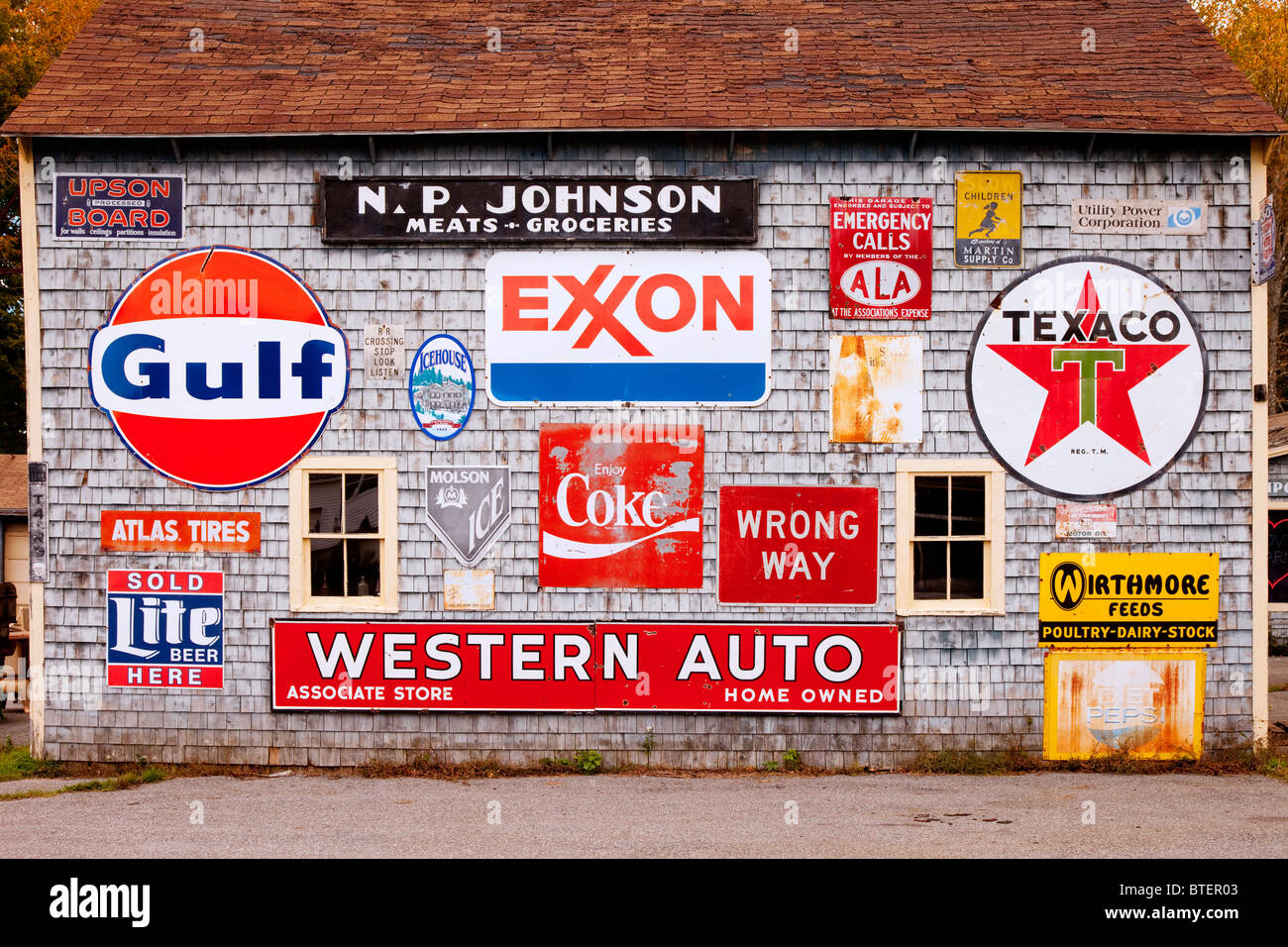 Old signs on an antique dealer's shop near Bucksport, Maine, USA Stock Photo