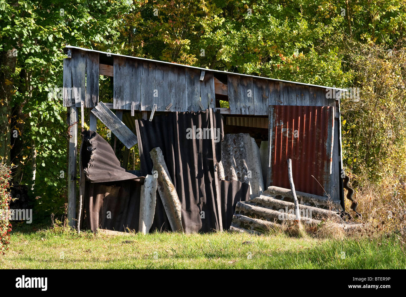 Old shed made from timber and corrugated iron - France. Stock Photo