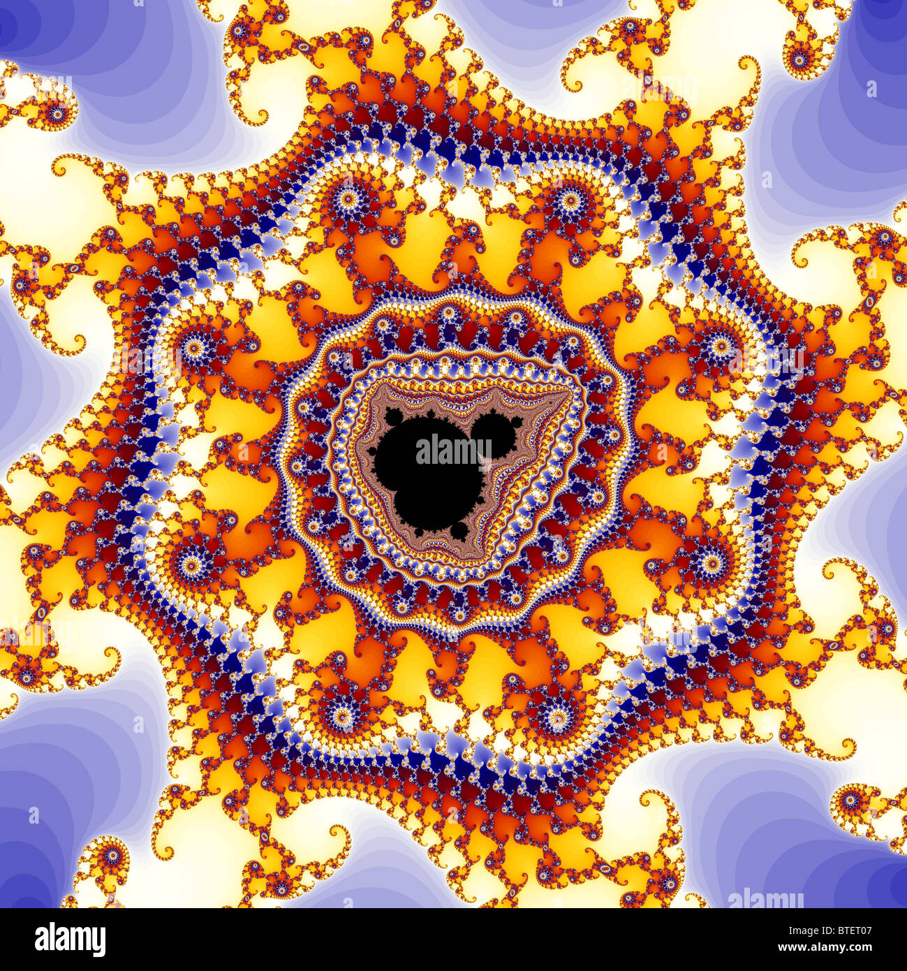 The Mandelbrot Set contains an infinite number of smaller copies of itself, usually surrounded by intricate patterns. Stock Photo