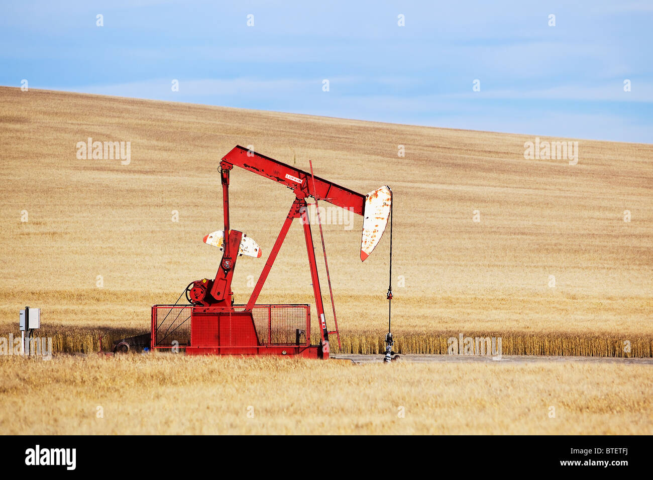 Oil well pump jack, near Swift Current, Saskatchewan, Canada. Stock Photo