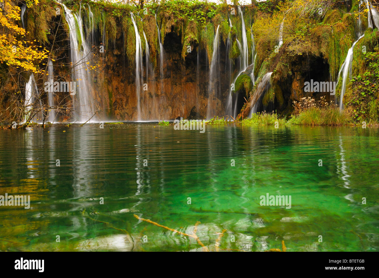 Pond and waterfalls in autumn lush vegetation in Plitvice (Croatia - Hrvatska) Stock Photo