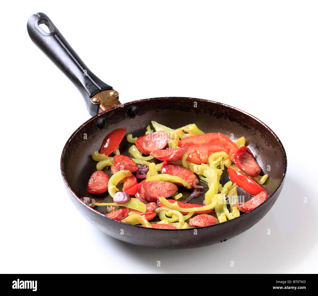 Preparing a vegetable and sausage stir fry Stock Photo - Alamy