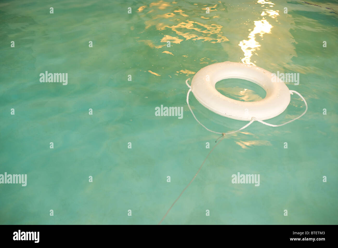 A life preserver floats in the swimming pool Stock Photo Alamy