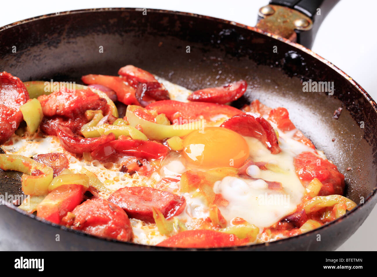 Vegetable and sausage stir fry Stock Photo - Alamy