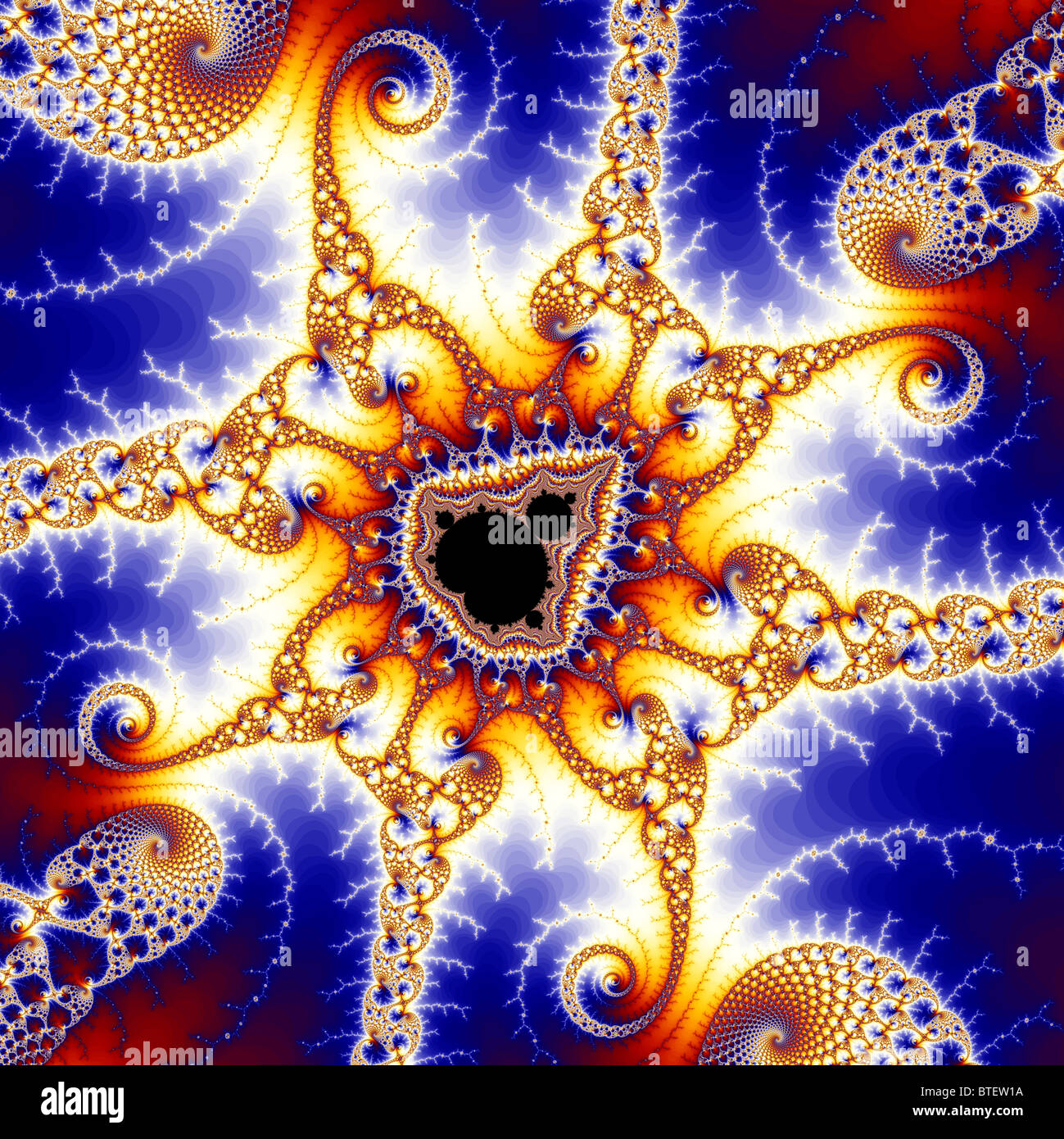 The Mandelbrot Set contains an infinite number of copies of itself, usually surrounded by intricate patterns. Stock Photo