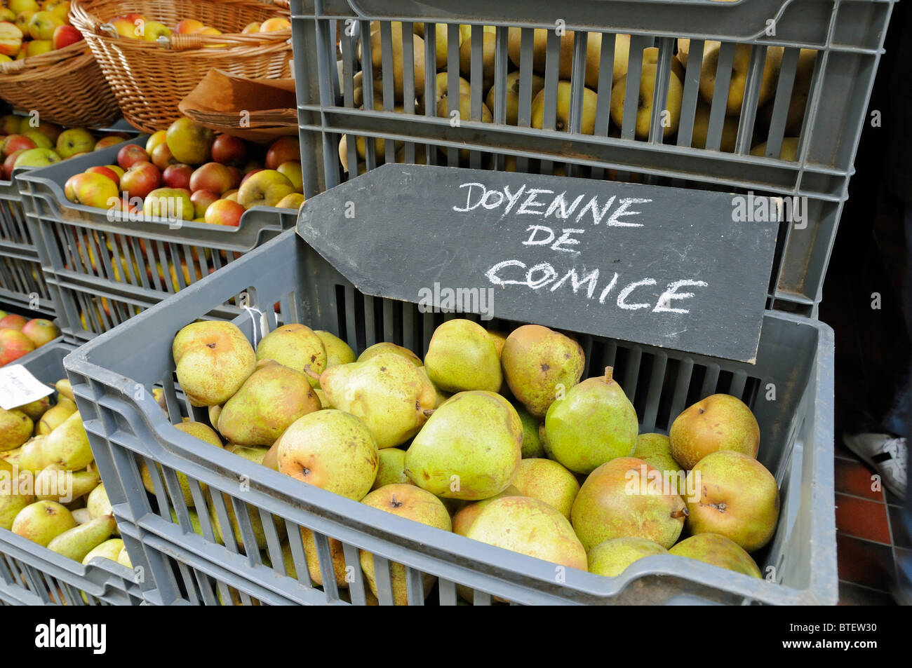 Doyenne De Comice Pears with attractive chalk sign in container outside shop in Covent Garden London England UK Stock Photo