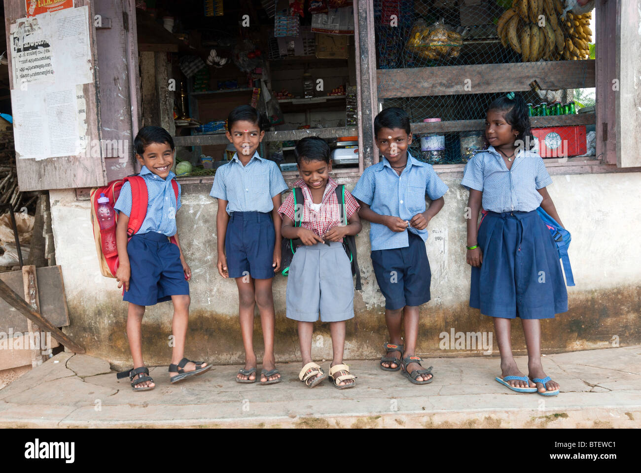Children waiting to go to school, Alappuzha, Kerala, India. Stock Photo