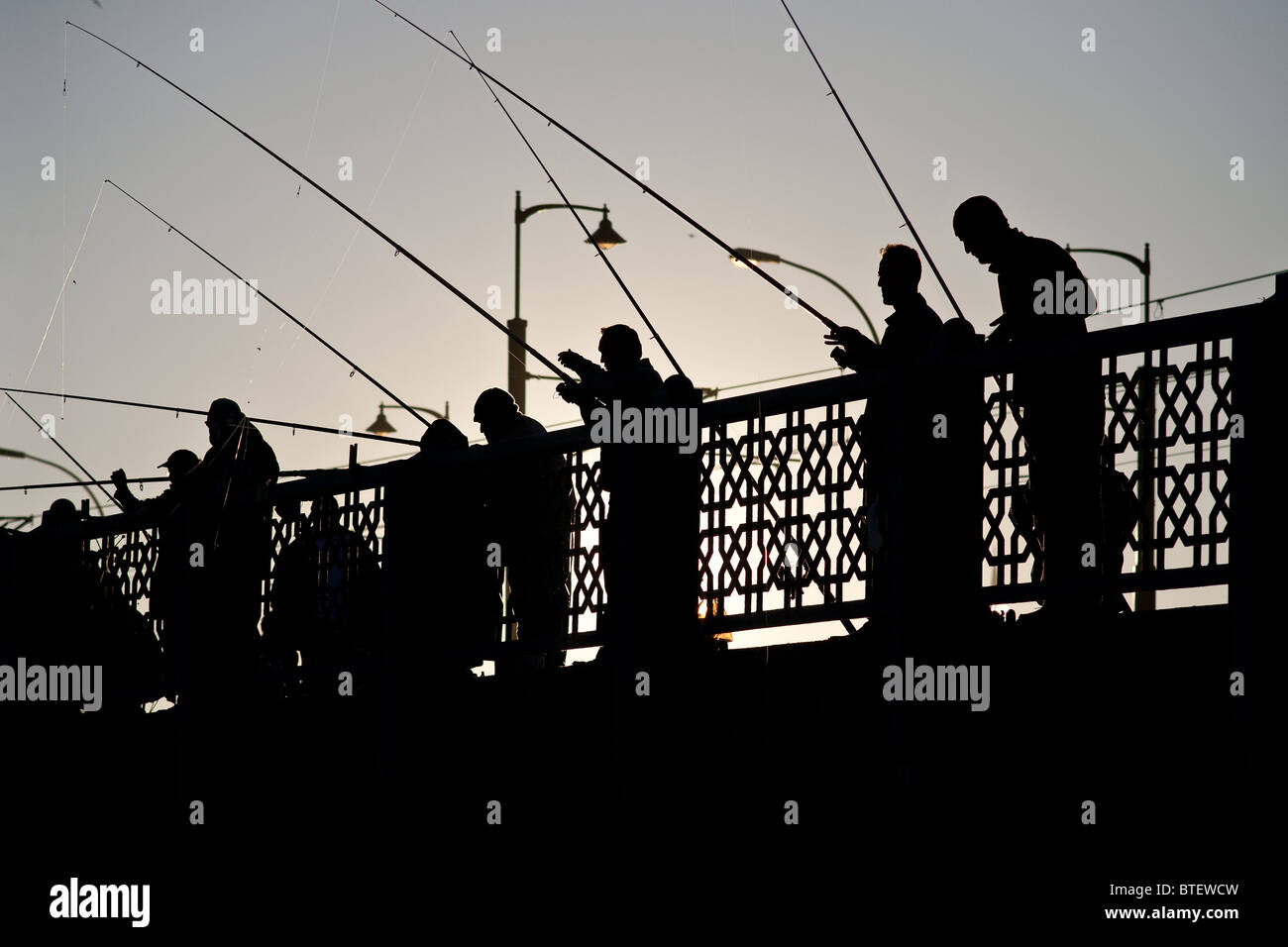 Silhouette of fishermen Stock Photo - Alamy