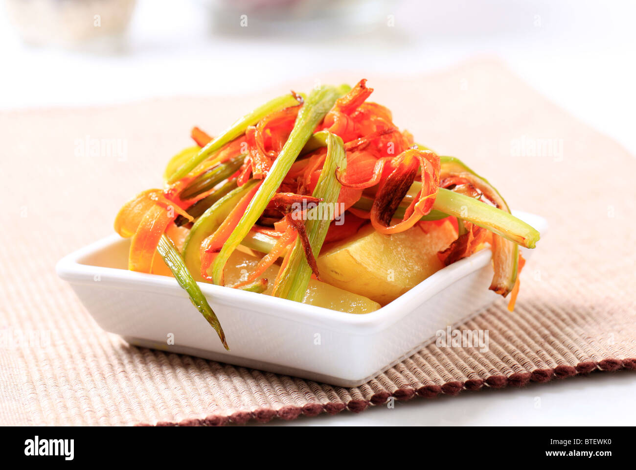 Stir fried celery and carrot strips on potatoes Stock Photo Alamy