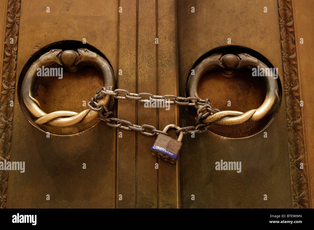 Chain and lock on a bronze door handles inside the replica of the ... Chain and lock on a bronze door handles inside the replica of the ...