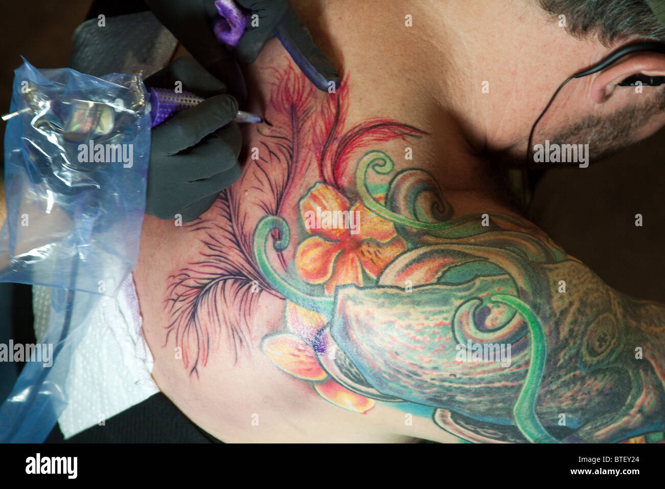 Here is a close-up shot of a colorful tattoo, being done at the Tattoo Showdown, El Paso's First Tattoo Convention. Stock Photo