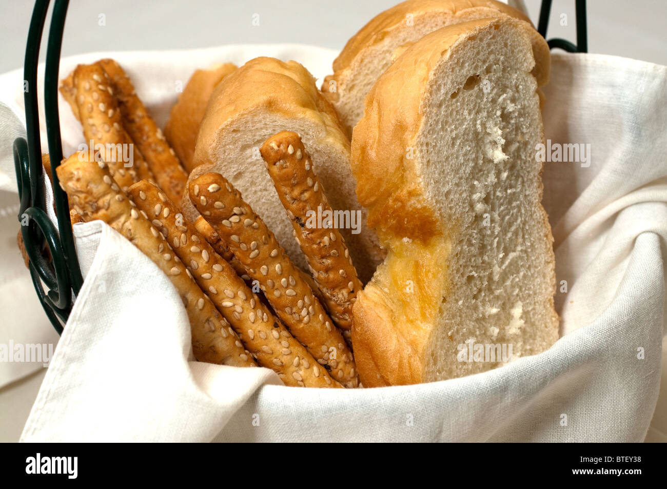 Italian bread and bread sticks in basket. Stock Photo