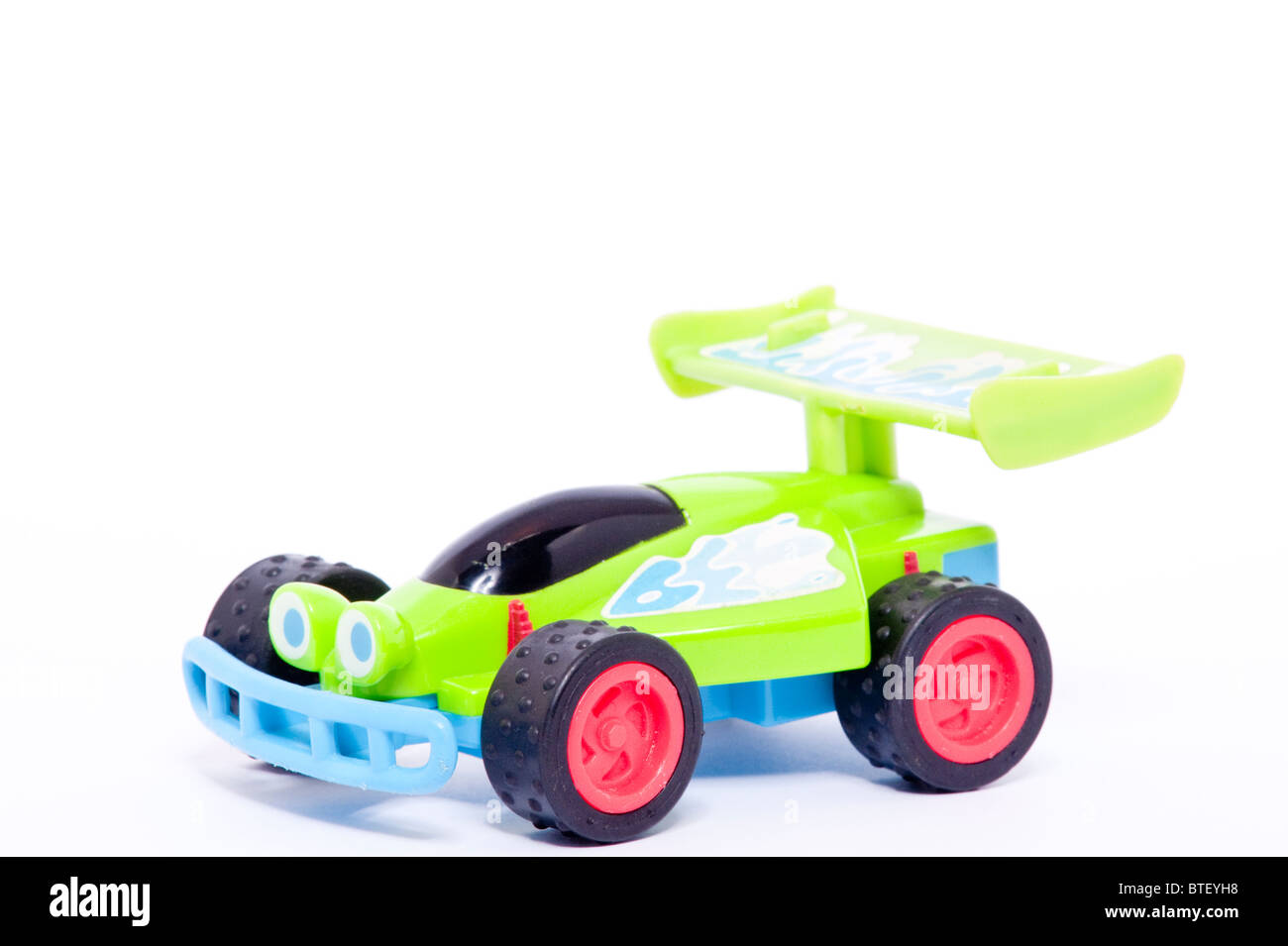 A close up photo of a childs toy RC car buggy from the Toy Story films against a white background Stock Photo