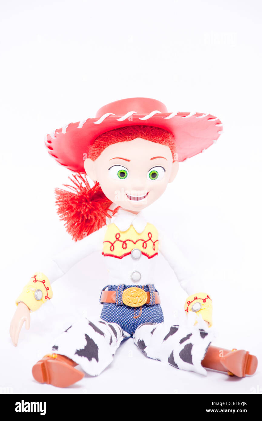 A close up photo of a childs toy Jessie character from the Toy Story films against a white background Stock Photo