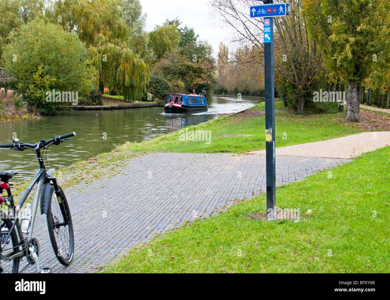 Bicycle on Canal Path next to  Water Stock Photo