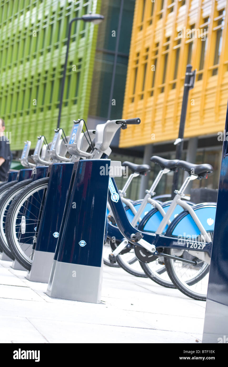 Boris bikes/Barclays bike hire machines in docking stations waiting for customers Stock Photo